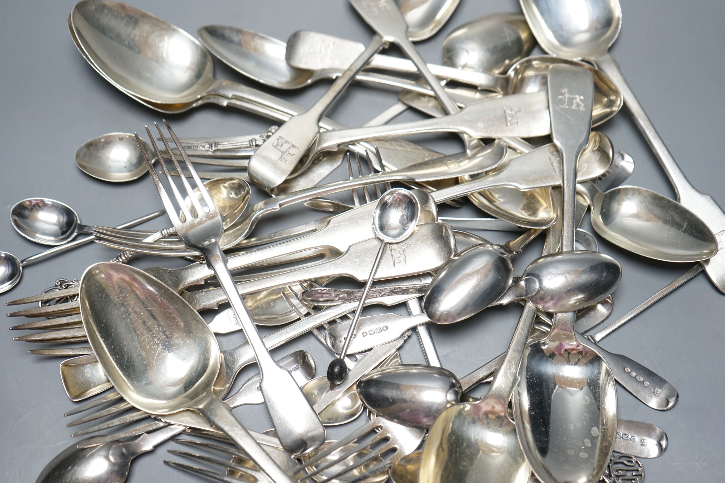 A set of six early Victorian Irish silver fiddle pattern table spoons, Philip Weekes, Dublin, 1844 and a quantity of assorted mainly 19th century flatware, various dates and makers